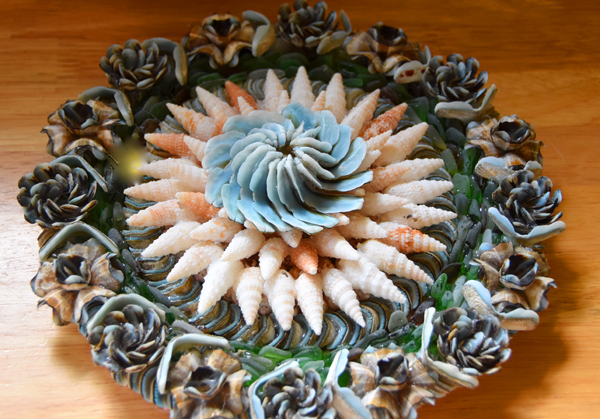 Wall-hanging-featuring-flowers-from-Blue-Chiton-shells